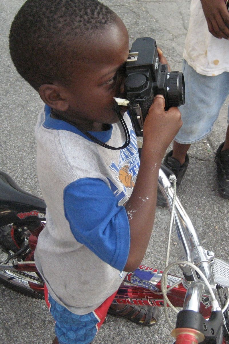 haitian boy with camera